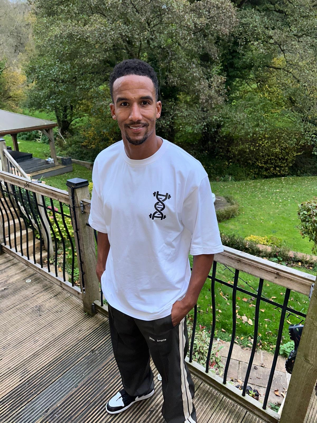 Scott Sinclair wearing white oversize tee from front 
