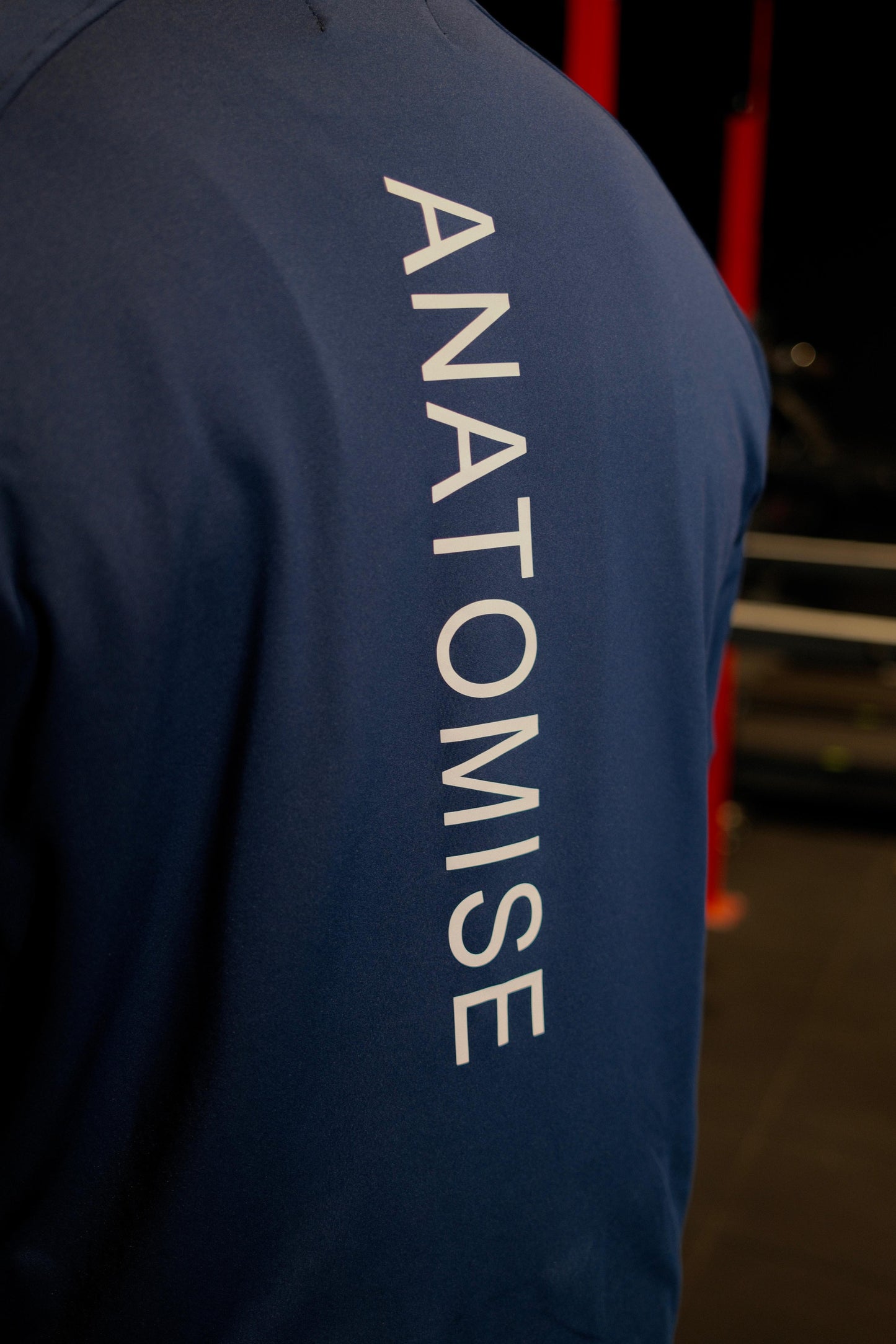 Midnight Navy quarter zip with 'Anatomise' on the back