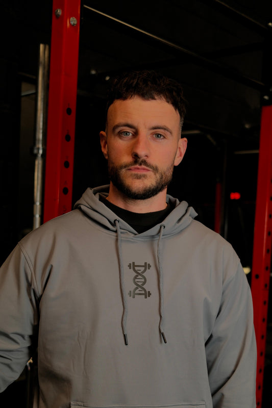 Male wearing anatomise pebble grey hoodie from front